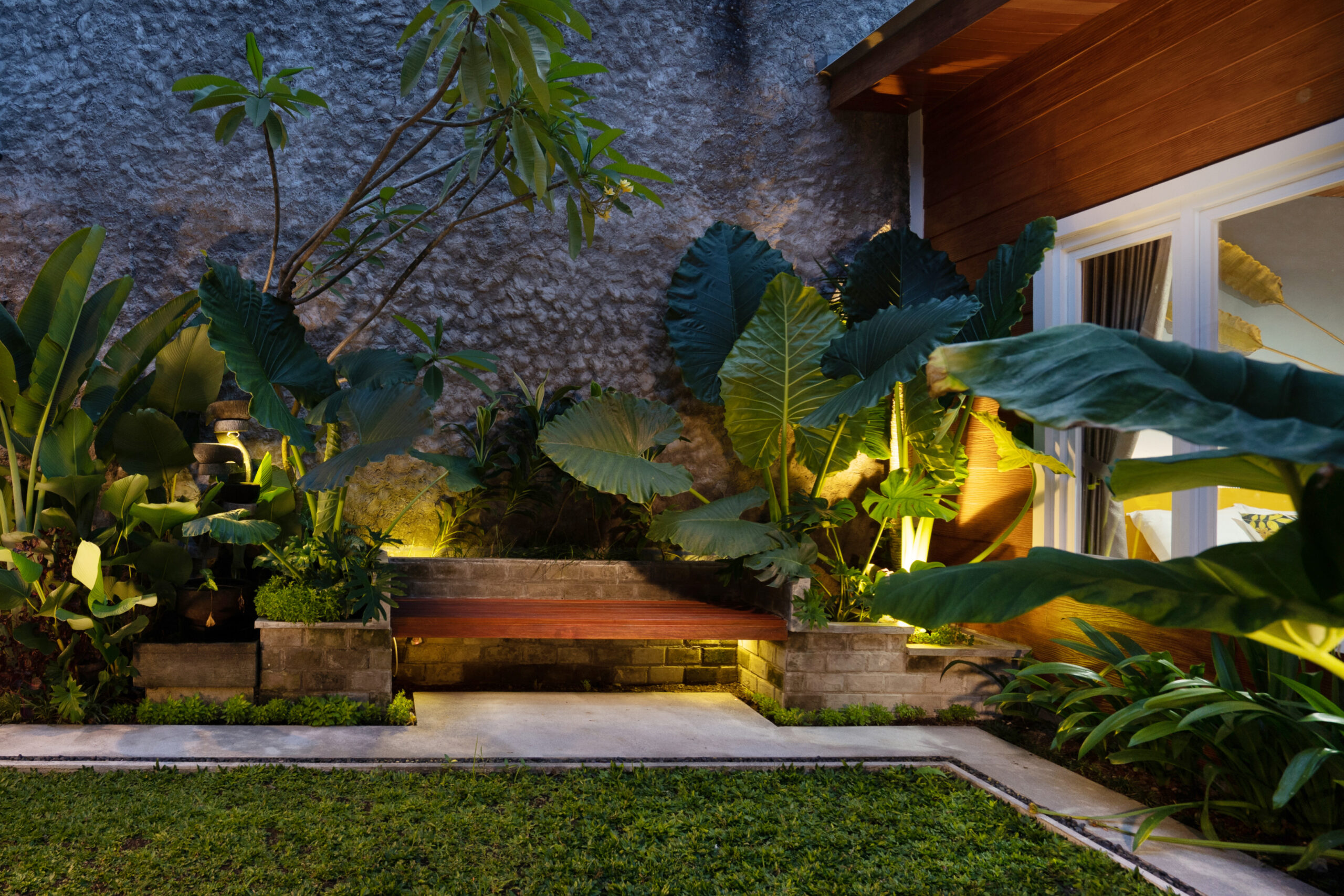 Tropical Backyard Garden at Night with Various of Plants